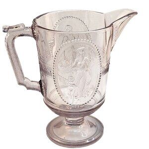 Antique Clear Glass Victorian Style Pitcher With Embossed Greek Mythology Design